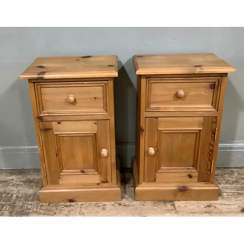 112 - A pair of pine bedside cabinets with one drawer above single door