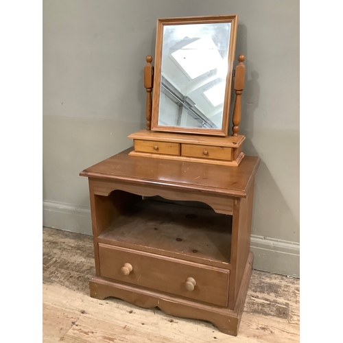 122 - A pine media cabinet with recess and single drawer, together with a dressing table swing mirror with... 