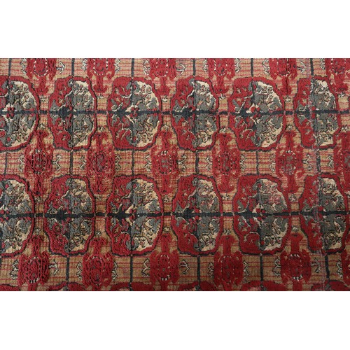 278 - A Middle Eastern rug, the flatweave field of camel colour with thin red stripe, filled with ten rows... 