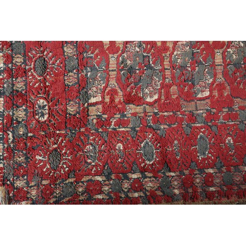 278 - A Middle Eastern rug, the flatweave field of camel colour with thin red stripe, filled with ten rows... 