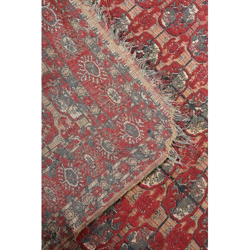 278 - A Middle Eastern rug, the flatweave field of camel colour with thin red stripe, filled with ten rows... 