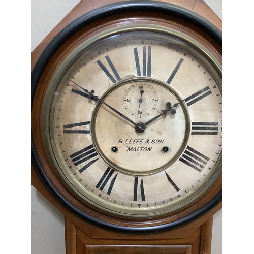 239 - A walnut and ebonised wall clock by the Ansonia clock company, New York, having a cream dial with Ro... 