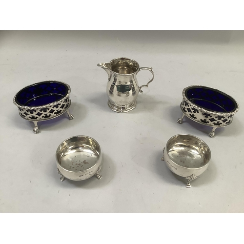 290 - A pair of silver open salts, oval, pierced with blue glass liners on claw and ball feet, London 1900... 