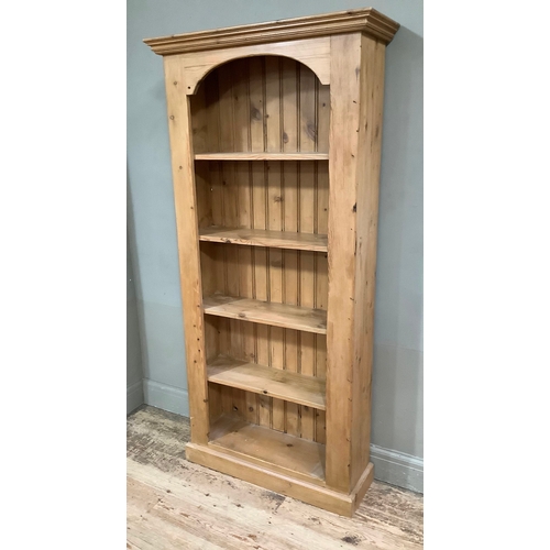 114 - A pine open bookcase with plank back and four shelves