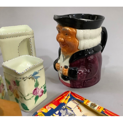 142 - Coronation memorabilia, a puzzle jug, a pearlescent jug, a musical toby jug and other ceramics