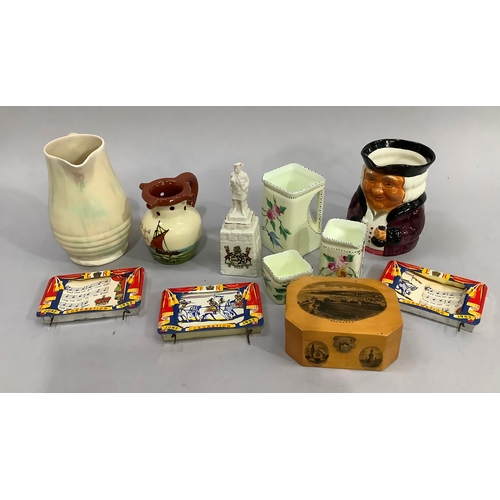 142 - Coronation memorabilia, a puzzle jug, a pearlescent jug, a musical toby jug and other ceramics