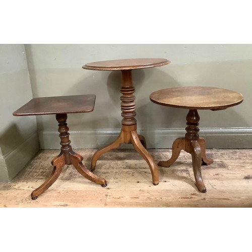 406 - Three 19th century mahogany tripod tables, two circular and one rectangular on reduced columns