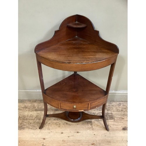 408 - An early 19th century mahogany corner wash stand with under tier and drawers and further under tier