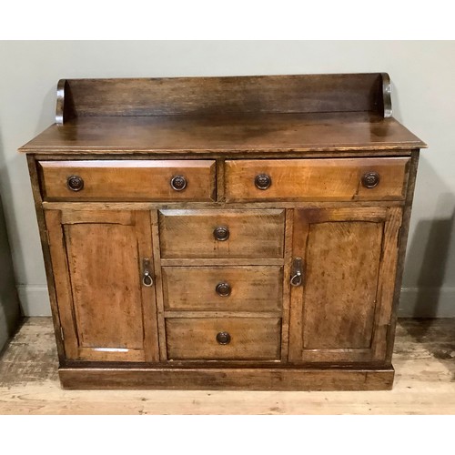 444 - An early 19th century oak dresser having a short raised back above two drawers over three drawers to... 