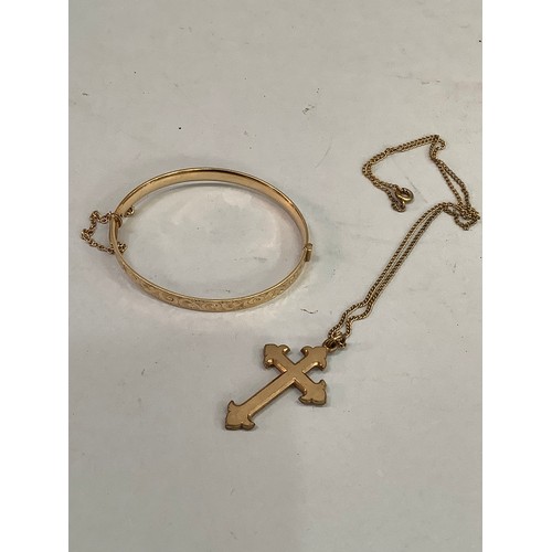 332 - An early 20th century Fleuree cross pendant and chain in rolled gold together with a rolled gold ban... 