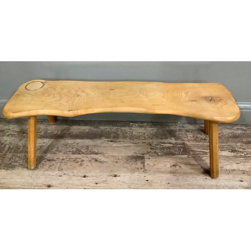 411 - A rustic bench coffee table on chamfered legs, 110cm wide