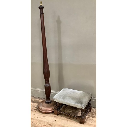 413 - An early 20th century mahogany standard lamp carved with leaf collars and on a circular base togethe... 