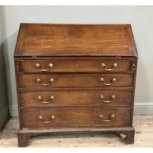 416 - A mahogany bureau in the Georgian style having a fall front with interior fitted with small drawers ... 