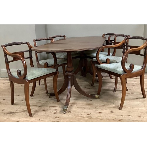 429 - A mahogany extending twin pedestal dining table together with a set of six Regency style dining chai... 