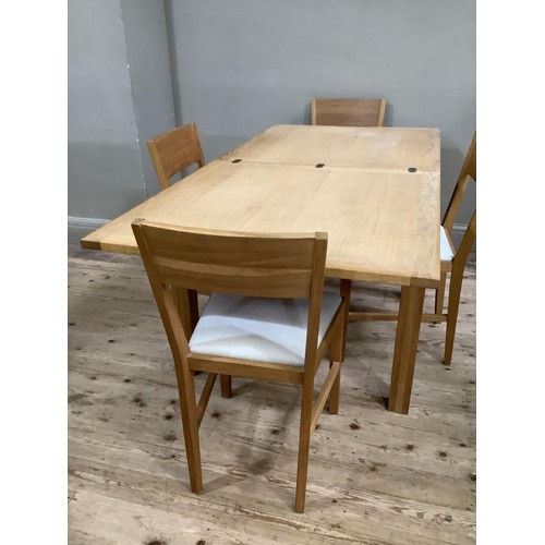 430 - A Laura Ashley pale oak draw leaf dining table and four bar back chairs with oatmeal upholstered sea... 