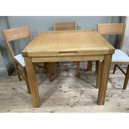 430 - A Laura Ashley pale oak draw leaf dining table and four bar back chairs with oatmeal upholstered sea... 