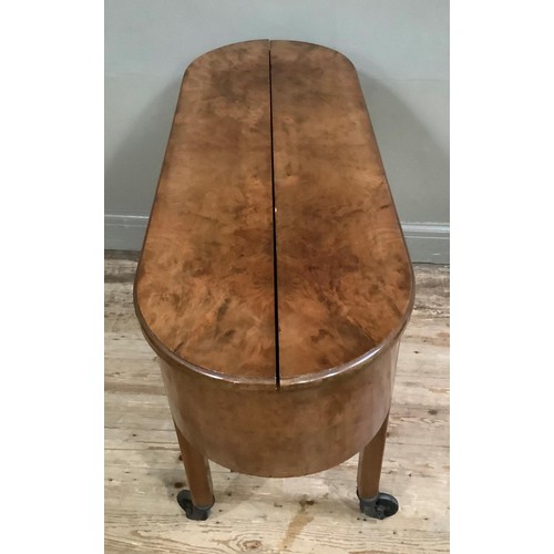 431 - A 1930s figured walnut drinks cabinet having fold out top and pop-up centre fitted for bottles and g... 