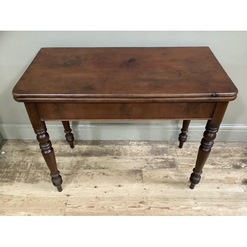 433 - A 19th century mahogany fold over tea table, rectangular, on turned legs, 95cm wide