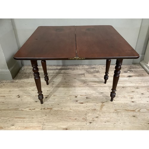 433 - A 19th century mahogany fold over tea table, rectangular, on turned legs, 95cm wide