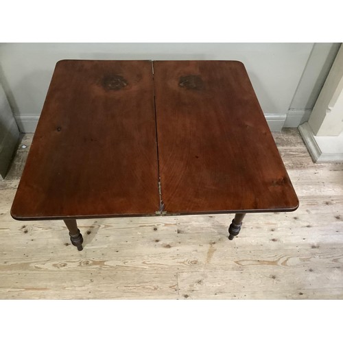 433 - A 19th century mahogany fold over tea table, rectangular, on turned legs, 95cm wide