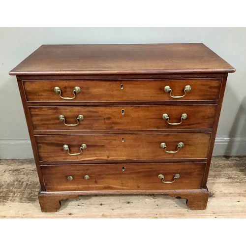 440 - A small 19th century mahogany chest of four graduated drawers with brass swing handles and on shaped... 