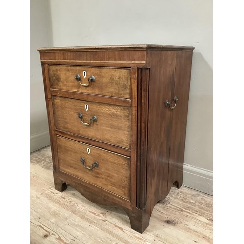 439 - An oak and mahogany chest of three graduated drawers with bone escutcheons flanked by reeded pilaste... 