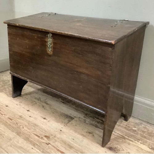 448 - An 18th century boarded chest having a slightly sloped top, with later brass hinges and escutcheon, ... 