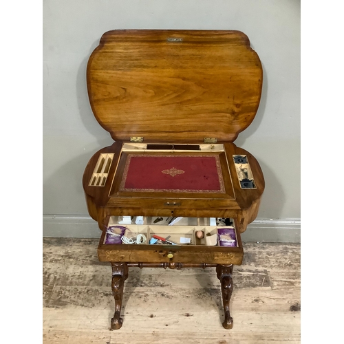 458 - An inlaid Victorian walnut work table with leather writing inset, two inkwells, stationary well with... 