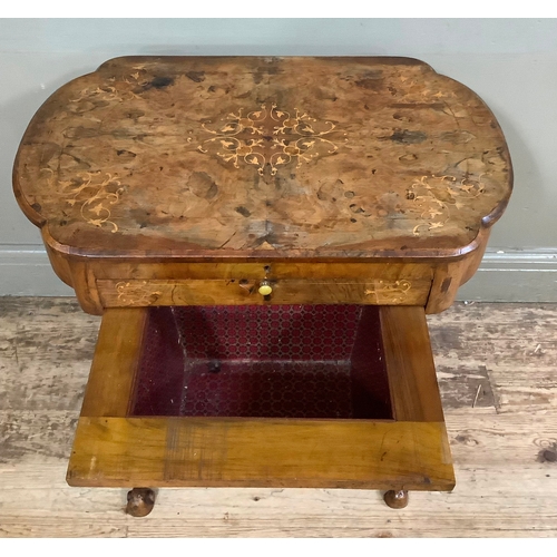 458 - An inlaid Victorian walnut work table with leather writing inset, two inkwells, stationary well with... 