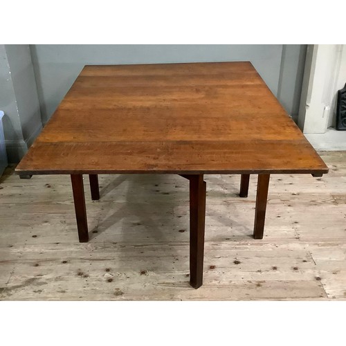 449 - An oak Pembroke dining table having rectangular drop leaves on square framing, 112cm wide