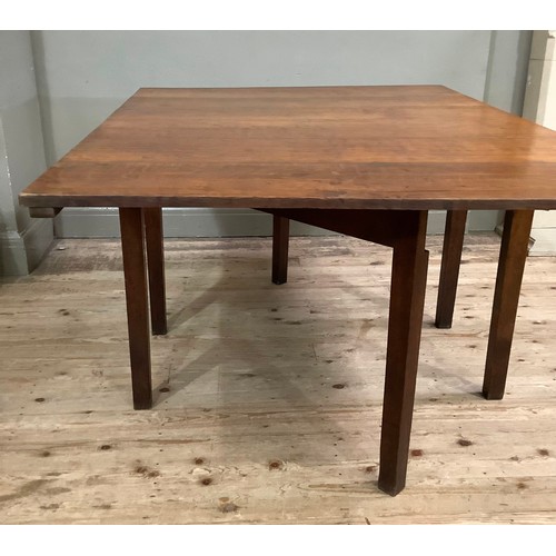 449 - An oak Pembroke dining table having rectangular drop leaves on square framing, 112cm wide