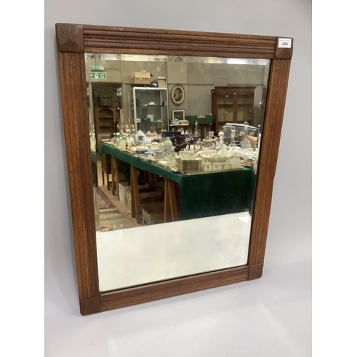 264 - An oak framed wall mirror with bevelled glass, c1910, 72cm by 57cm