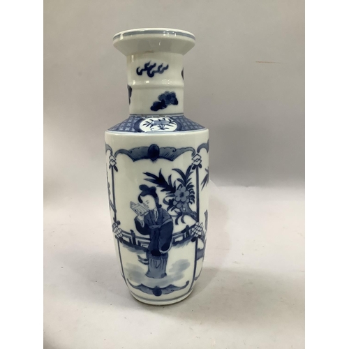 6B - A Chinese blue and white Kangxi style rouleau vase painted with a figure reading in a garden