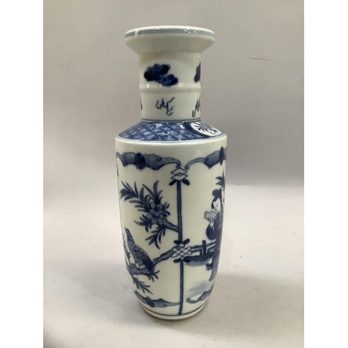 6B - A Chinese blue and white Kangxi style rouleau vase painted with a figure reading in a garden