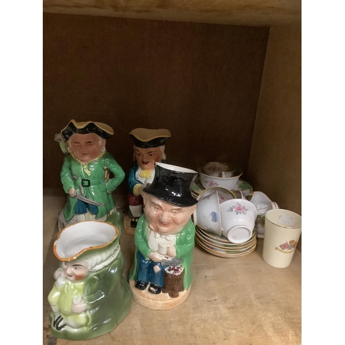 88 - Quantity of ceramics including toby jugs and a bevelled wall mirror