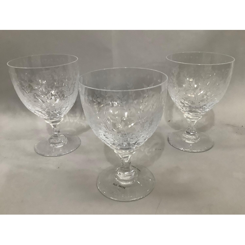 1 - A set of three wine goblets  by William Yeoward, the bodies etched with fronds with dented stems, 16... 