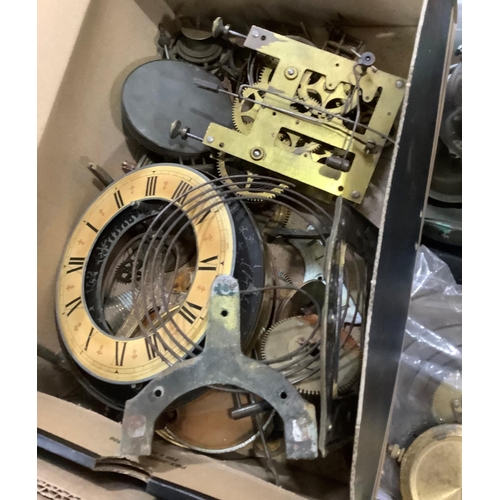 109 - A large quantity of re-purposed 19th and 20th century clock parts including weights, key, case parts... 