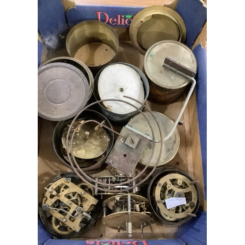 109 - A large quantity of re-purposed 19th and 20th century clock parts including weights, key, case parts... 