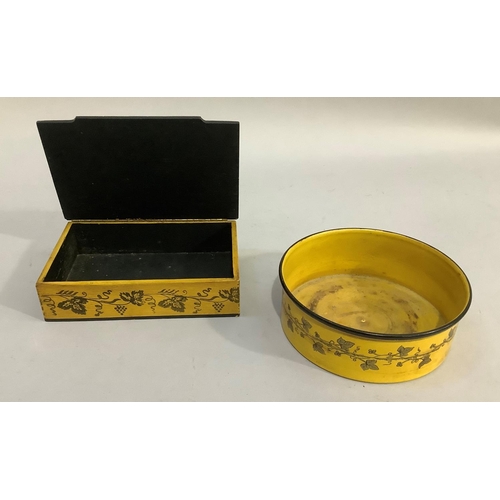 20 - A yellow and black lacquered lidded box, the top having a romantic scene the sides having garlands o... 