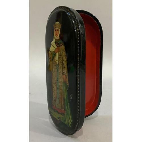 22 - A Russian black lacquered oval lidded box, the lid painted with a woman in gown and crown, 17cm