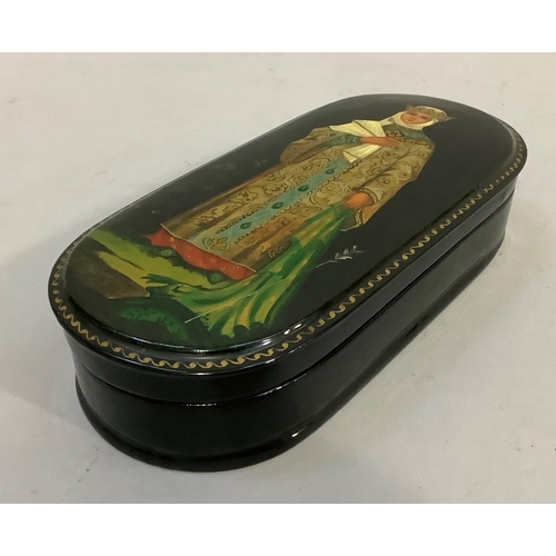 22 - A Russian black lacquered oval lidded box, the lid painted with a woman in gown and crown, 17cm