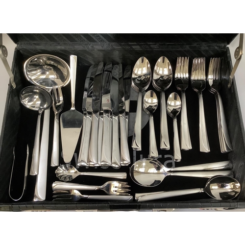 46 - A suite of stainless steel cutlery by Swiss Jura, twelve place settings including table knives and f... 