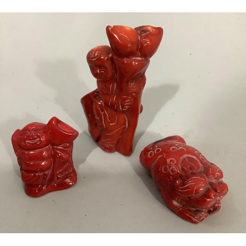 7 - Three pieces of carved and stained coral