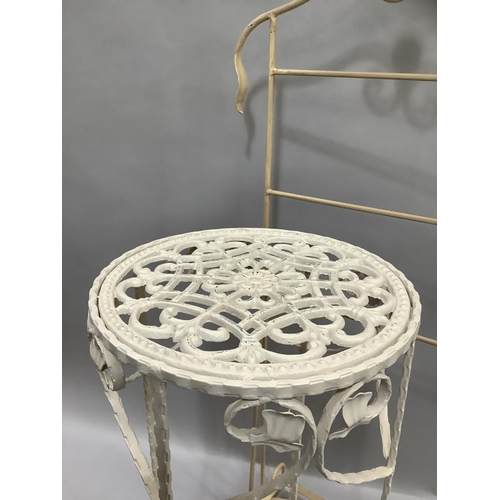 81 - A cream metal occasional table of pierced circular outline with leaf scroll apron, 76cm high x 32cm ... 