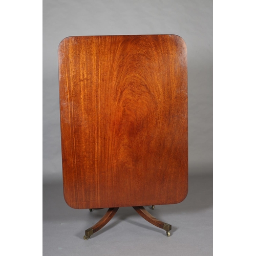 406 - An early 19th century mahogany breakfast table having a rectangular tilt top with rounded corners, o... 