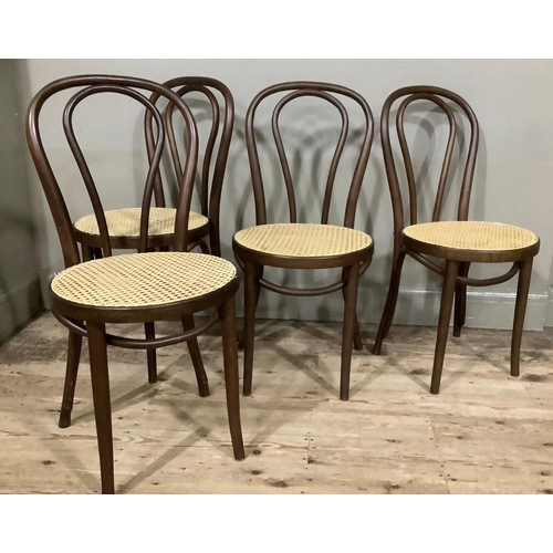 410 - A set of four modern bent wood and begere caned dining chairs