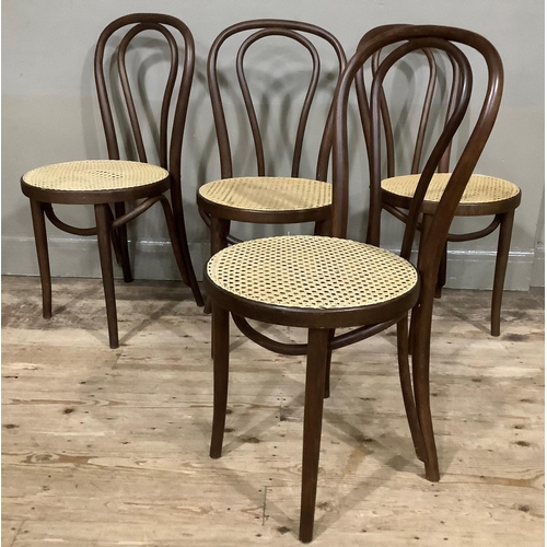 410 - A set of four modern bent wood and begere caned dining chairs