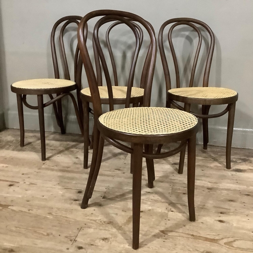 410 - A set of four modern bent wood and begere caned dining chairs