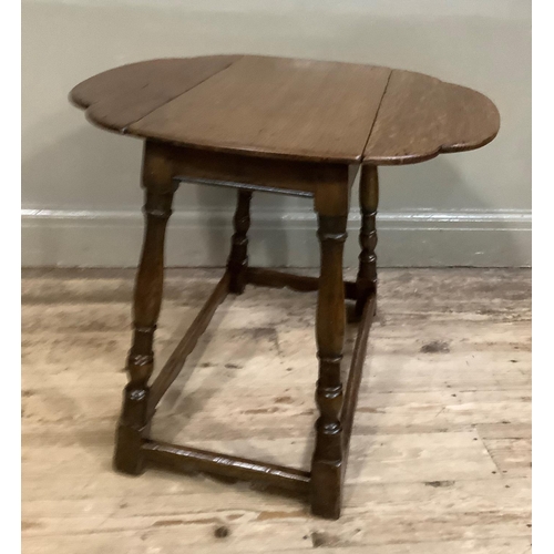 412 - An oak  drop leaf occasional table of oval outline on turned and square framing, 66cm deep x 66cm wi... 