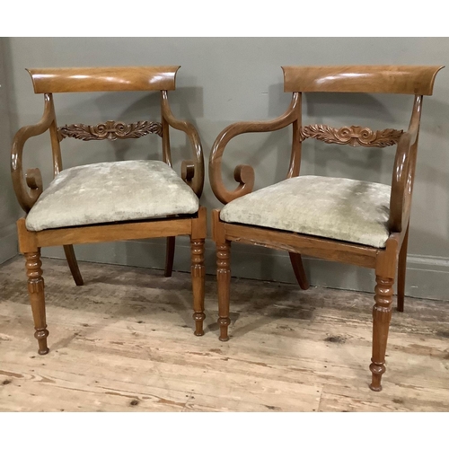 414 - A pair of mid 19th century rosewood carver chairs each having a bar back above foliate tie rail , up... 